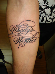 Alejandro Paul's Burgues Script Tatooed on someone